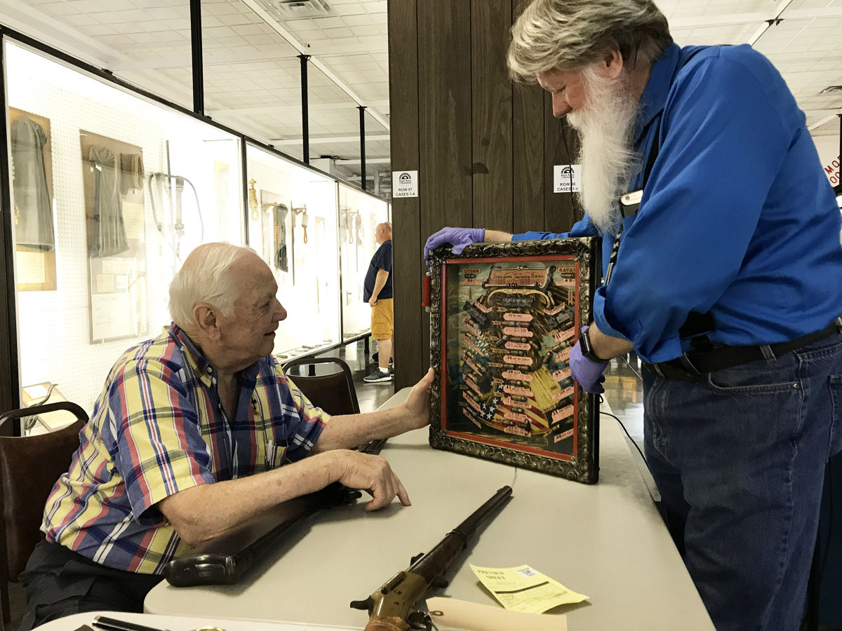 PREP WORK: Museum prepares for weapon, artifact auction